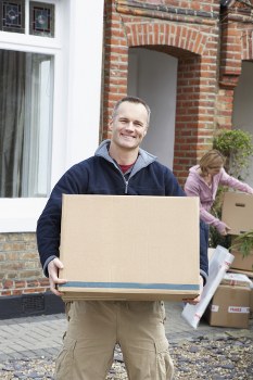 Removals van and moving team on a Stockwell residential street