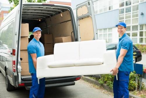 Removal team carefully handling boxes during a Stockwell home move