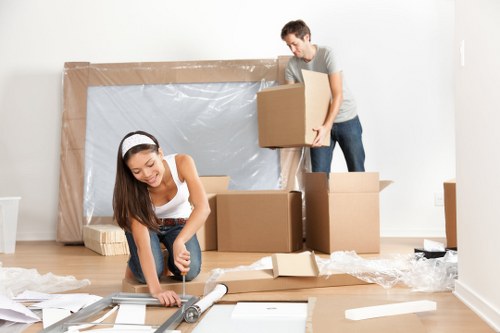Removal team loading boxes and furniture for a UK move