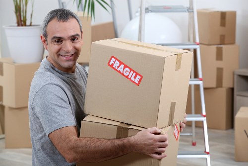 Removal van and moving team in a Stockwell residential street