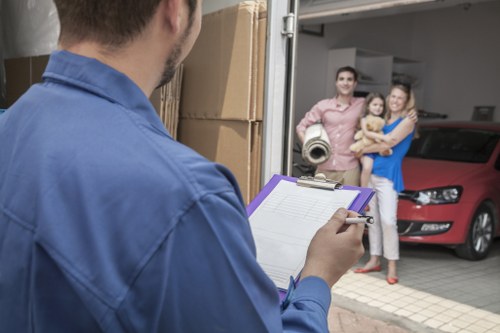 Packing and loading household items into a removals van