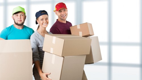 Man and van removals team loading boxes in Stockwell