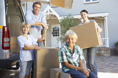 Local house movers preparing boxes and furniture for delivery in Stockwell