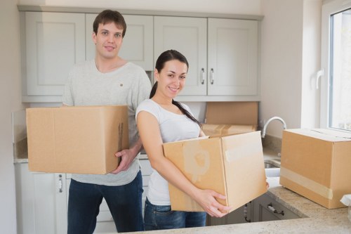 Loading household items into a moving van in Stockwell
